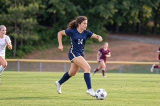 Fictional athlete advancing with the ball